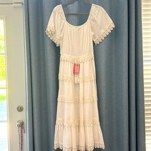 White dotted Swiss midi dress with crocheted trim and adjustable neckline